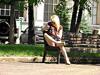 The blonde babe is friskily demonstrating the hot sitting upskirt in the park.